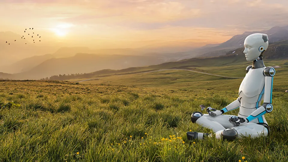 A humanoid robot sitting down in a serene landscape