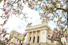 The University building and blossoming magnolias