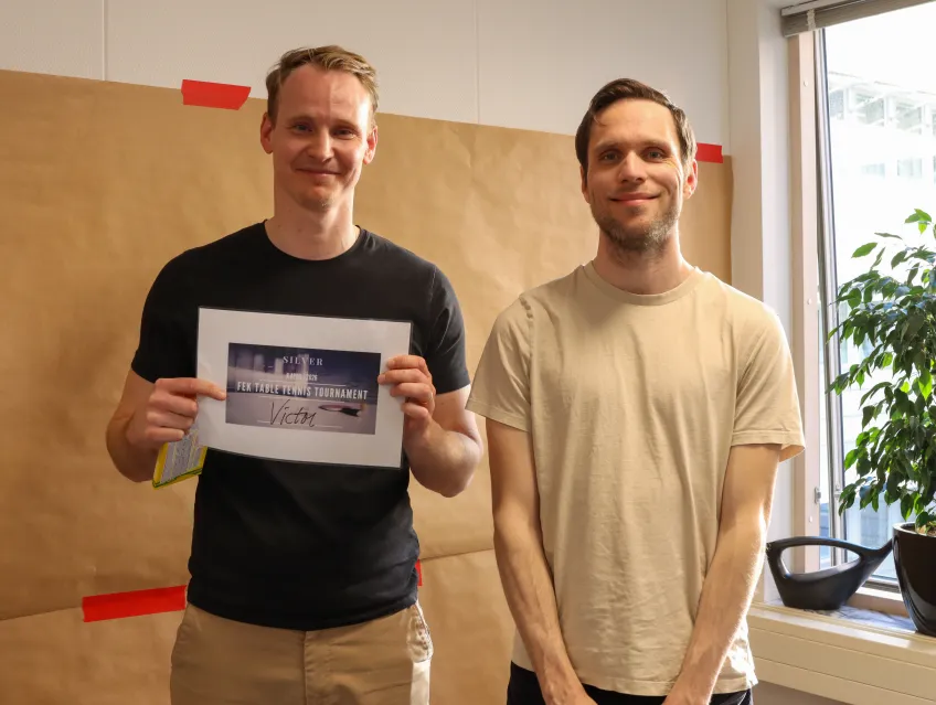 two happy male winners