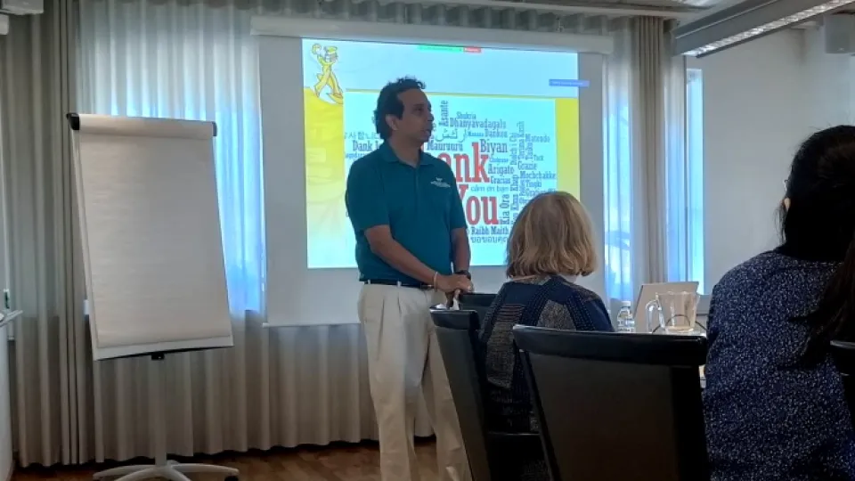 Photograph of Professor Viswanath Venkatesh holding a presentation. 