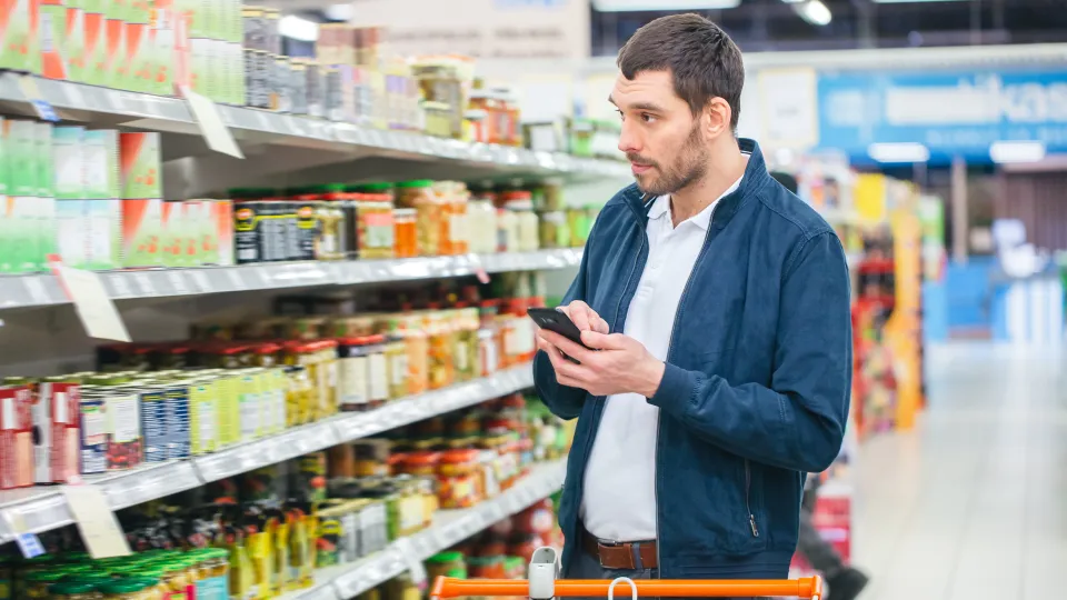 Photo of a man in a grocery store.