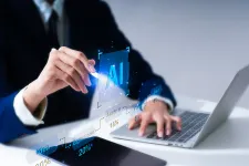 Photo of human hands and a laptop