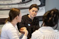 three women sitting around a table