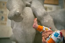 Baby foot, next to the baby foot of a statue