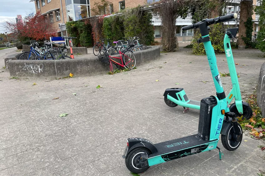 Electric scooter outside of a building. Photo.