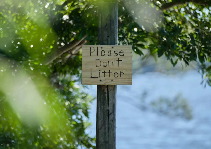 Photo of a sign in nature.