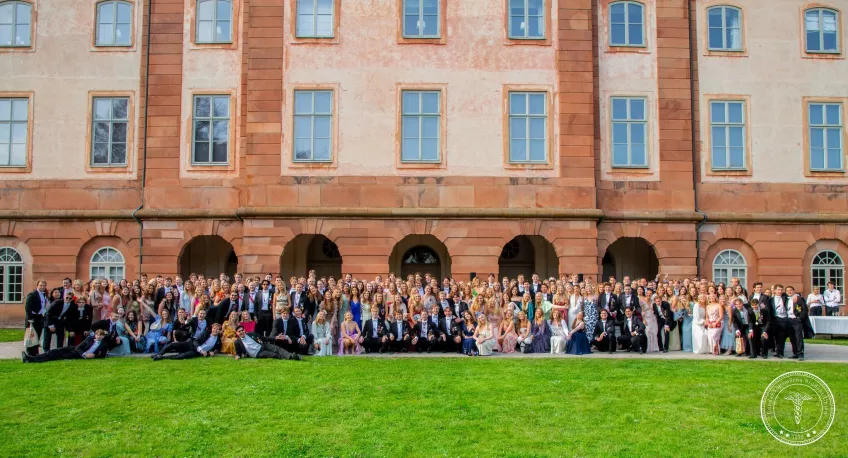 Big group of nicely dressed students posing. Photo. 